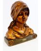 Bust of a Woman in Gilded Plaster in the Village