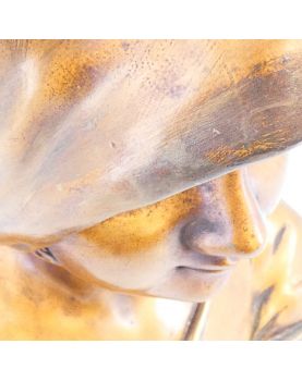 Bust of a Woman in Gilded Plaster in the Village