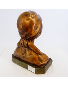 Bust of a Woman in Gilded Plaster in the Village