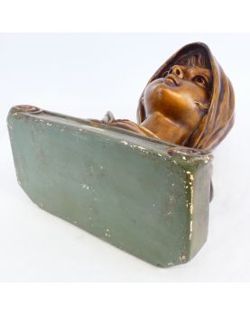 Bust of a Woman in Gilded Plaster in the Village