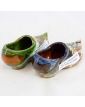 Pair of Glazed Earthenware Clogs